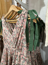 Load image into Gallery viewer, Perfect for... spring wedding guest dress, derby, baby shower dress, bridal shower dress, mothers day dress, or just a cute spring dress to wear for a casual brunch or aesthetic coffee run!
https://bridgetteandmain.com/products/marissa-tiered-ruffle-floral-maxi-dress
Rose Pink Tiered Ruffle Floral Maxi Dress
This stunning, rose pink maxi dress is designed with delicate, green shoulder ties and tiered ruffles, making it perfect for any special occasion - especially as a wedding guest dress. Its floral pr