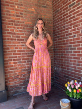 Load image into Gallery viewer, Marigold | Maxi Dress with Center Cutout
Effortlessly chic! All eyes will be on you in this stunning dress featuring a sultry deep V-neck and alluring cutout. Perfect for a night out or special event, you'll feel confident and beautiful. The spaghetti straps add a touch of femininity, while the maxi length elongates your figure. A must-have for any fashion-forward wardrobe.