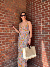 Load image into Gallery viewer, Sage Floral Maxi with Romantic Ruffle details
The v-neck and twist front add unique visual interest, while the cut out and double slit design allow for comfortable and free movement. Step out with confidence and sophistication in this stunning maxi dress.

Details: 
Vneck Twist front 
Cut out detail
Double slit with ruffle details 
Maxi Dress

Perfect for:  Brunch, coffee dates, summer dress, casual ootd,  Summer vacation dress, Baby shower, bridal shower. 

