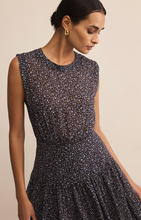 Load image into Gallery viewer, Woman wearing a sleeveless dress with a subtle pattern on a beige background
