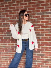Load image into Gallery viewer, Strawberry Fields Cardigan in White

Experience the height of comfort and style with our Strawberry Fields Cardigan. Made with high-quality materials, this stunning white cardigan radiates sophistication and charm. Featuring a timeless design and flawless craftsmanship, our cardigan is the must-have addition to your wardrobe, effortlessly elevating any outfit with its blend of glamour and coziness. Don&#39;t miss out on the Strawberry Fields Cardigan, the perfect embodiment of refined taste and exquisite fashio
